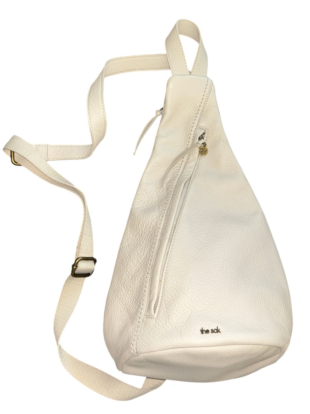 The SAK Cream Pebbled Leather Sling Bag with Canvas Back